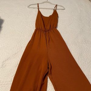 The cutest rust jumpsuit!